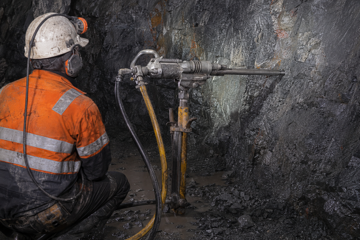 Air-leg pneumatic rock drill operating in an underground hard-rock mine
