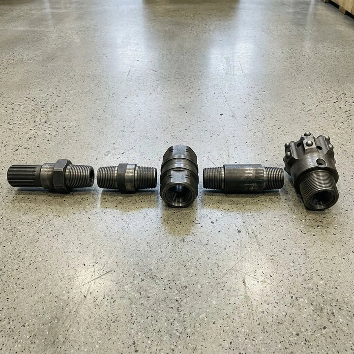 R32 threaded top hammer drill string showing a shank adapter connected to rods, coupling and bit