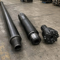 DTH drill pipe, hammer and matched button bit arranged as a complete drilling system