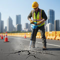 PerfoMax MO-4B pneumatic pick breaking asphalt pavement on a road repair site