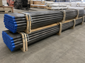 Bundled H22 drill rods prepared for export shipment